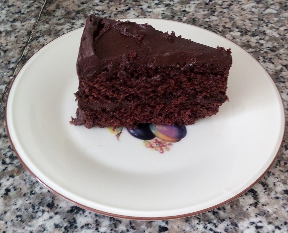 slice of chocolate layer cake with chocolate icing