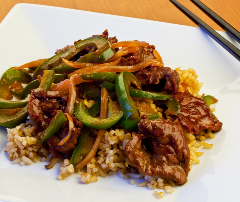 pepper steak on a bed of brown rice