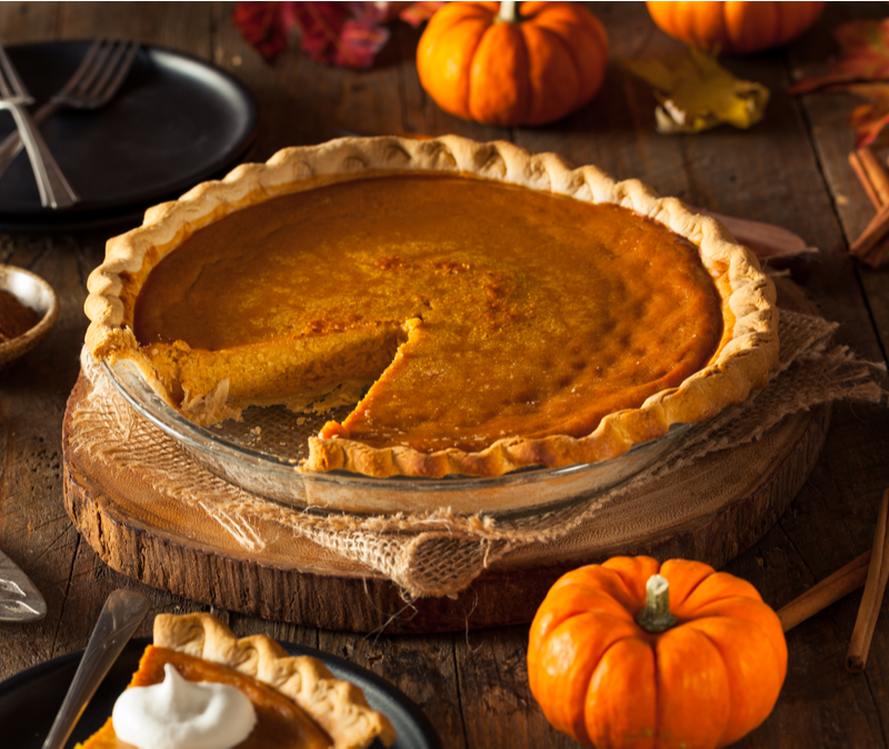 pumpkin pie with one slice removed