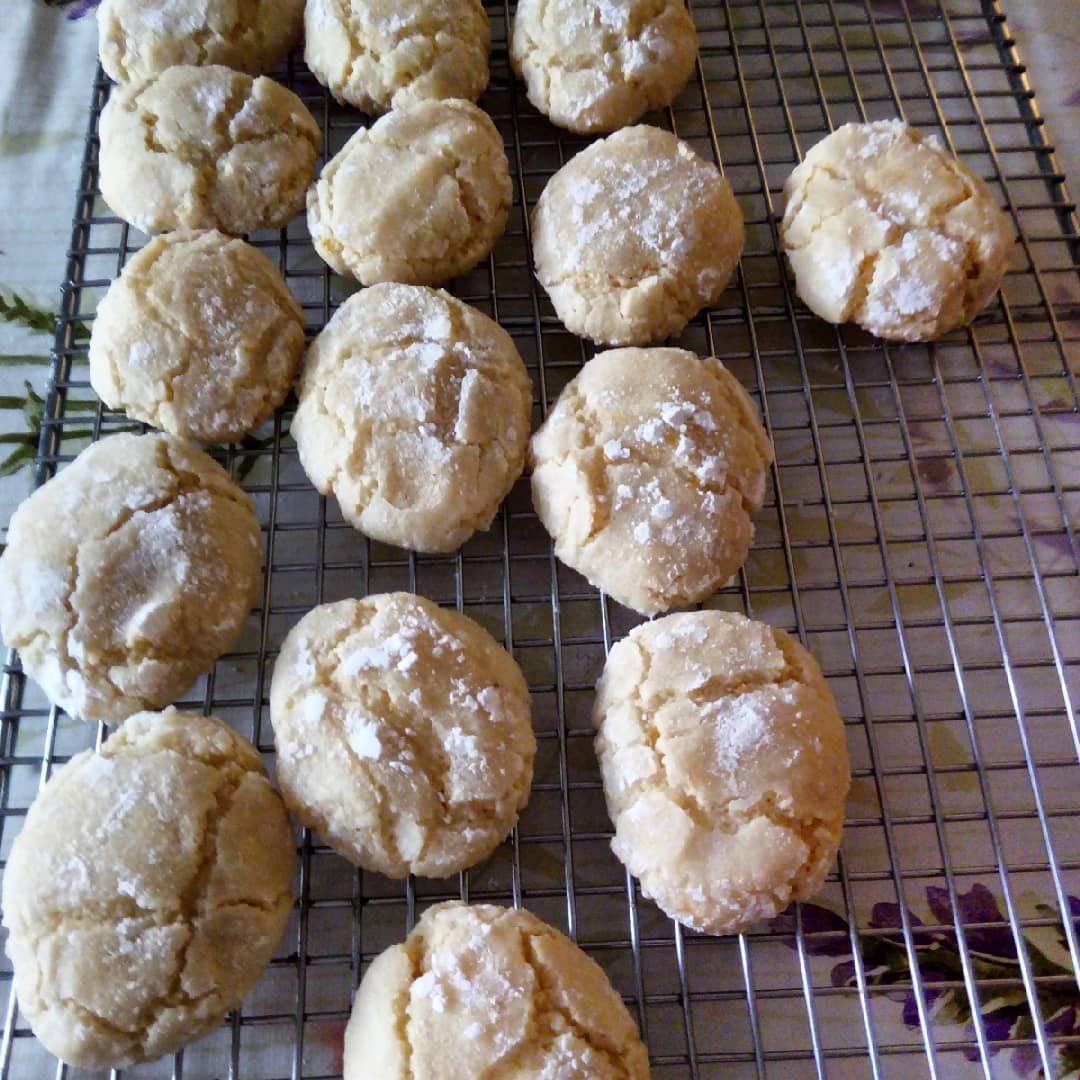 Ricciarelli biscuits cooling on a rack. Italian almond macaroons