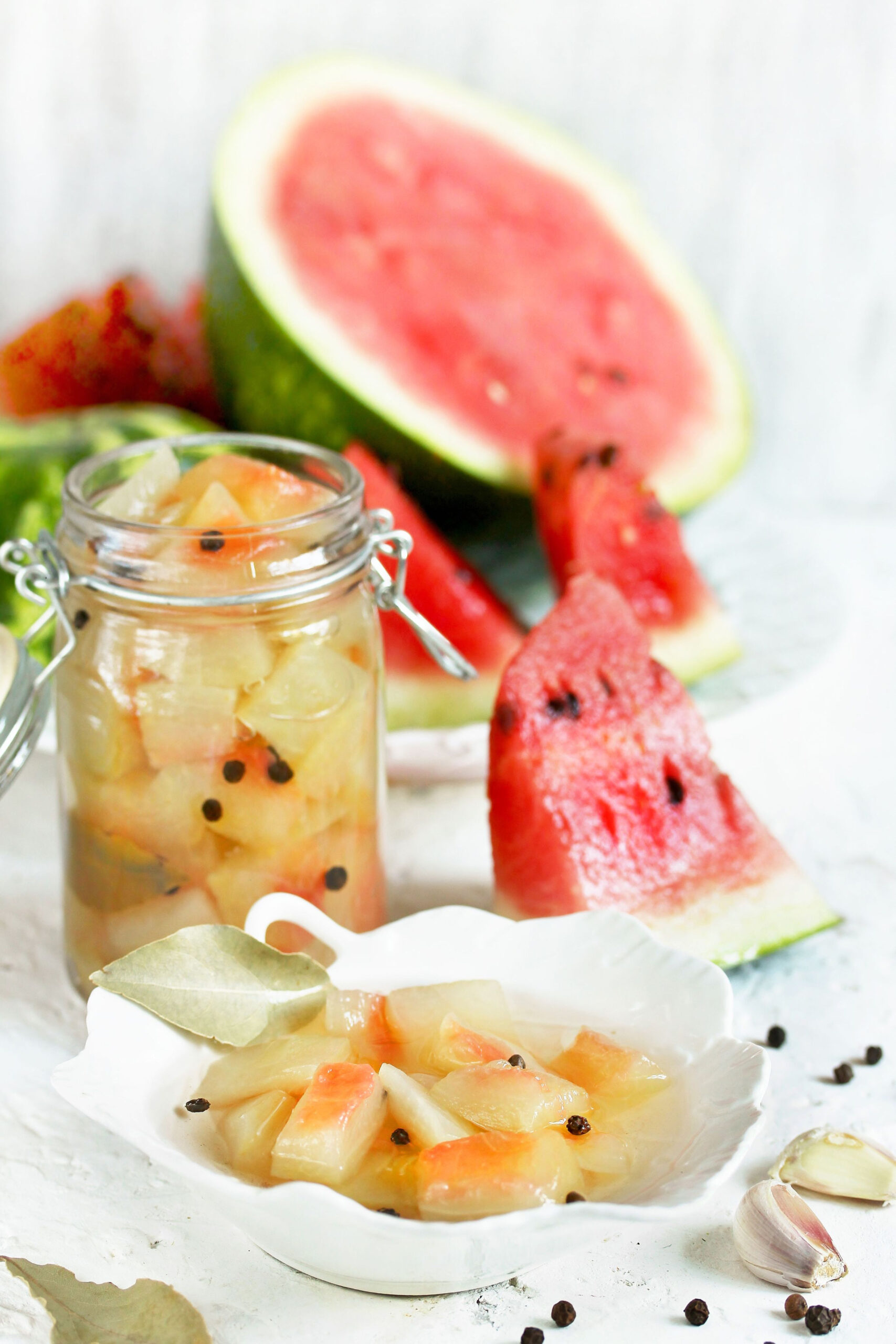 watermelon rind pickles in dish and jar watermelon alongside
